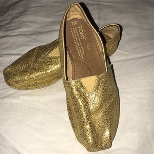 Toms women’s size 7 Metallic Gold shoes/slip ins